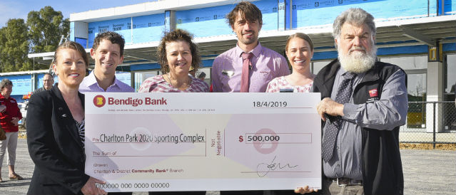 Board and staff of Community Bank Charlton with $500k cheque