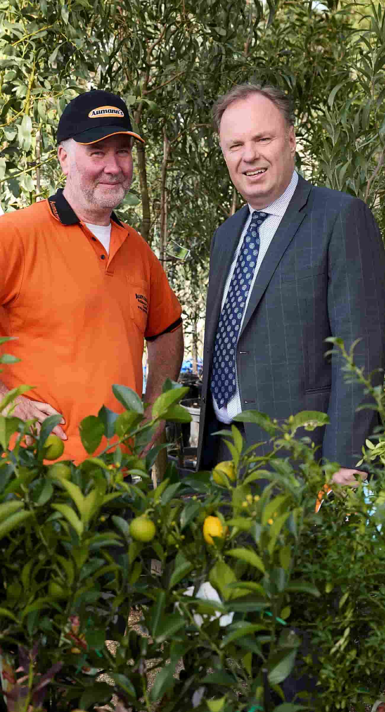 Aumann’s Building and Garden Supplies Andrew Mackintosh standing with their business banker Steve uit den Bogaard